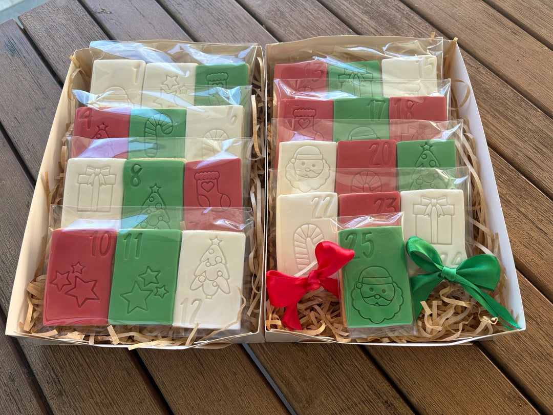 25 Fondant Sugar cookies in a mixture of red, green and white each with a festive design  