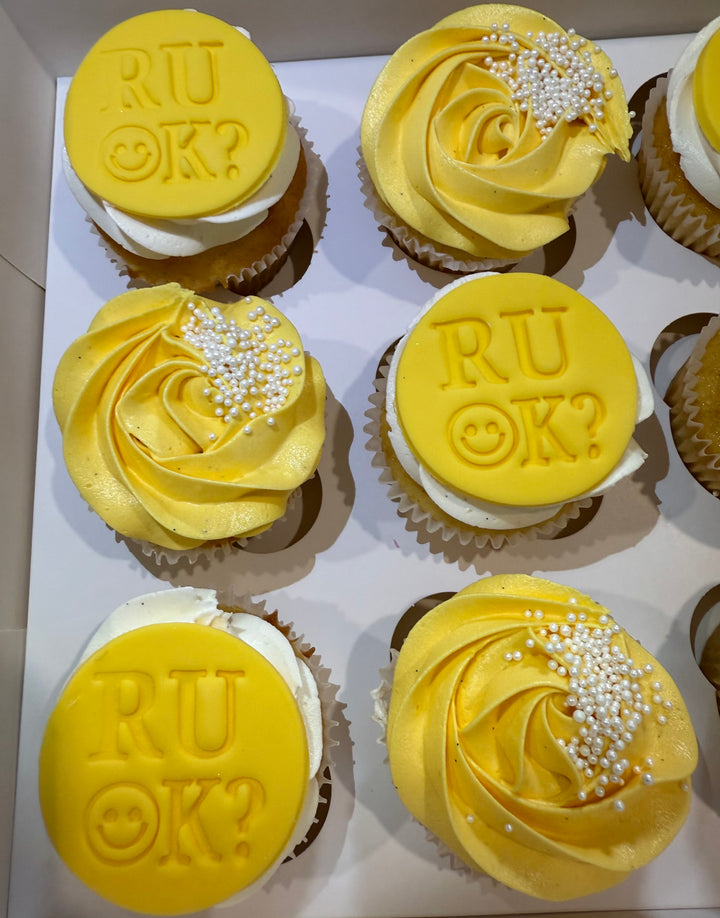 R U OK DAY Cupcakes with yellow frosting and 'R U OK?' message in a box