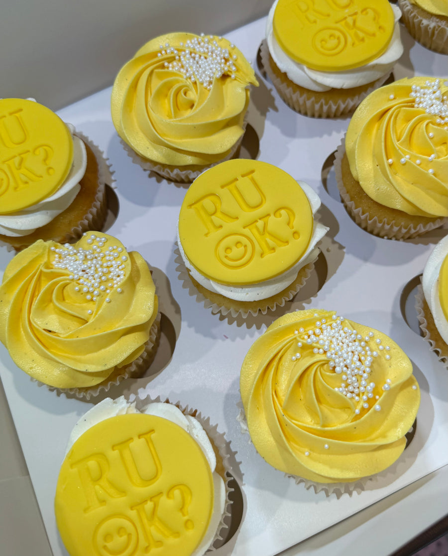 R U OK Day Cupcakes Brisbane with white sprinkles and yellow fondant disc 
